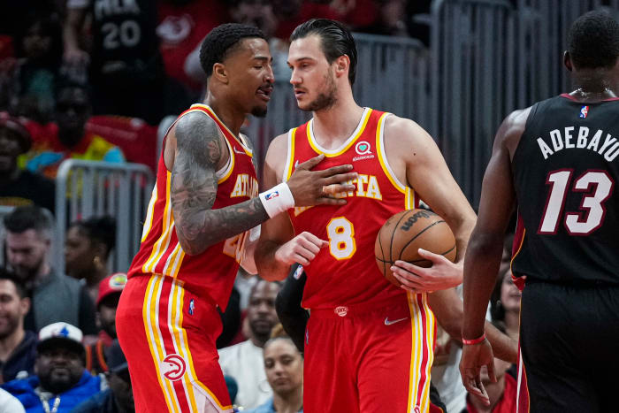 Apr 22, 2022; Atlanta, Georgia, USA; Atlanta Hawks forwards John Collins (20) and Danilo Gallinari (8) react after a basket against the Miami Heat during the first half of game three of the first round for the 2022 NBA playoffs at State Farm Arena.